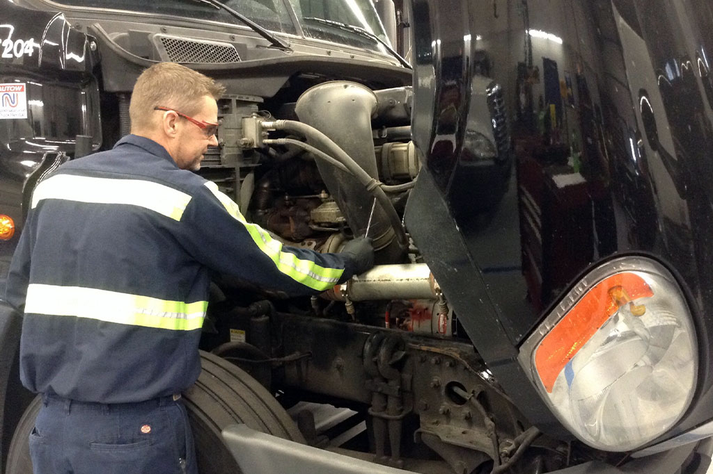 Diesel Technician working on engine