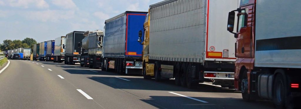 Row of trucks in traffic